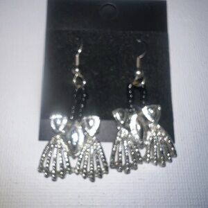 ♦️‎ Silver-toned metal charm with black stone, dangling silver-toned meta…